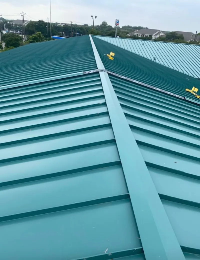 Green commercial metal roof ridge and valley for Metal Roof Repair in Aspen