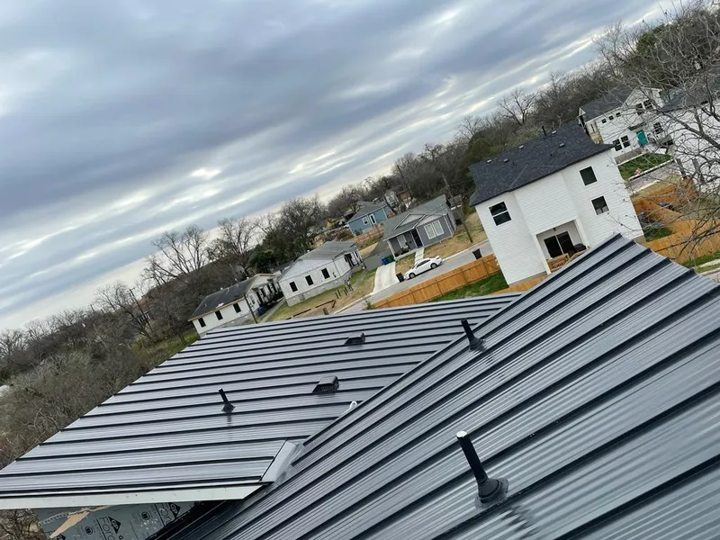 Standing seam metal roof panels with vents for Skylight Repair in Aspen
